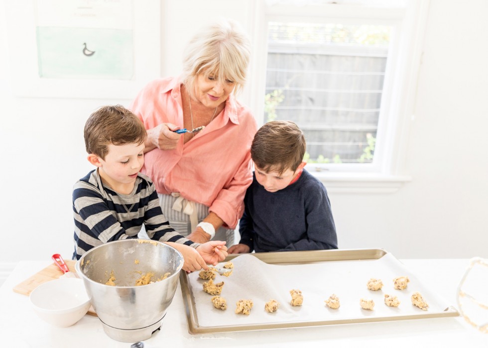 kids and woman baking in kitchen